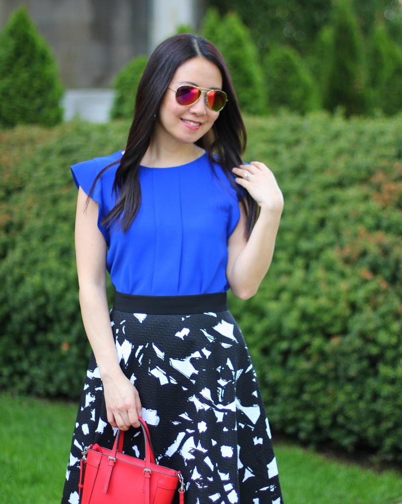 Banana Republic black floral midi skirt, Zara cobalt blue top, GUESS Delaney mini tote, bold colors